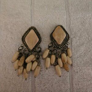 Pair of dangle clip on earrings with diamond shaped top